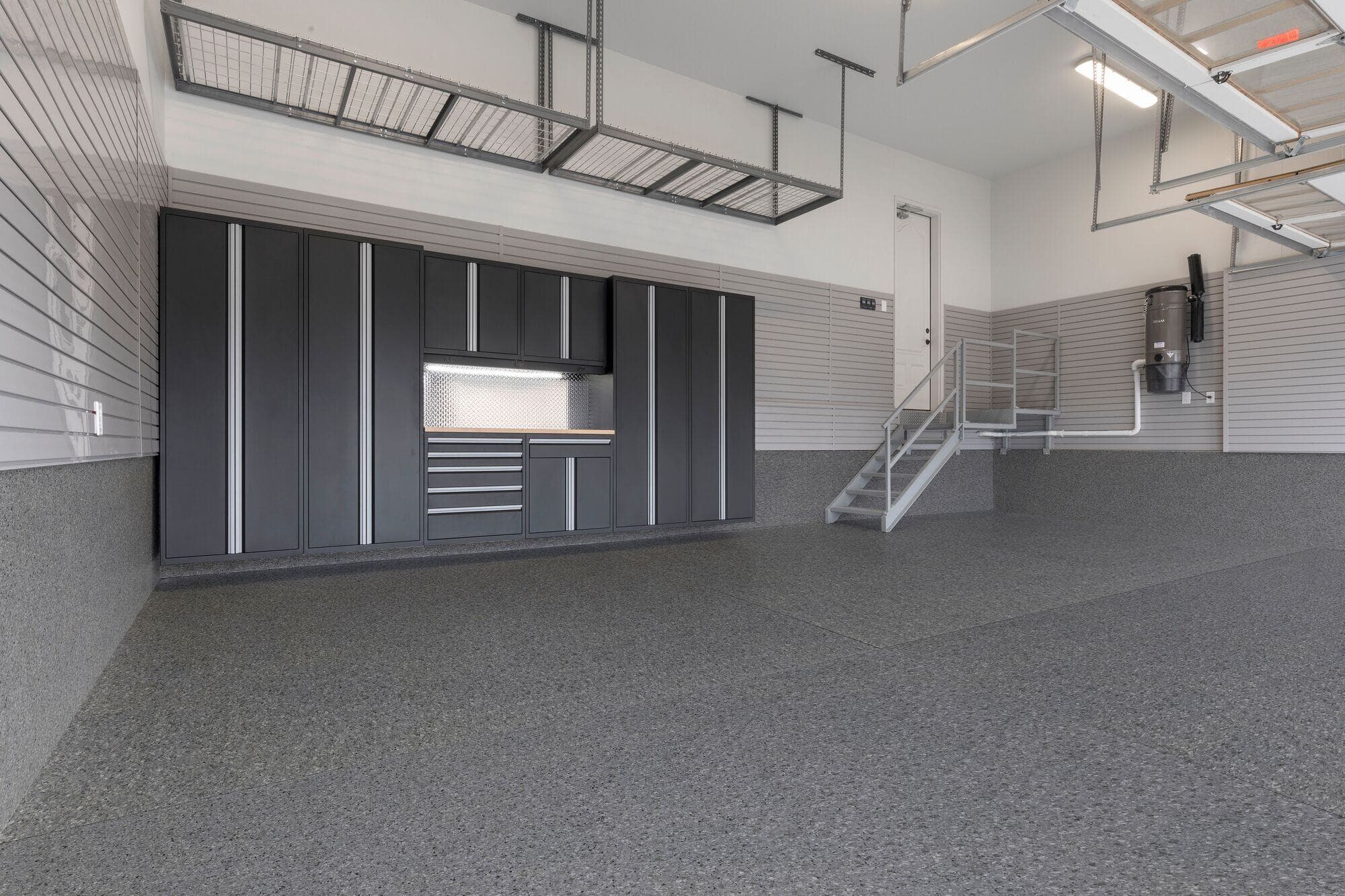 Premium dark epoxy garage floor with metallic finish